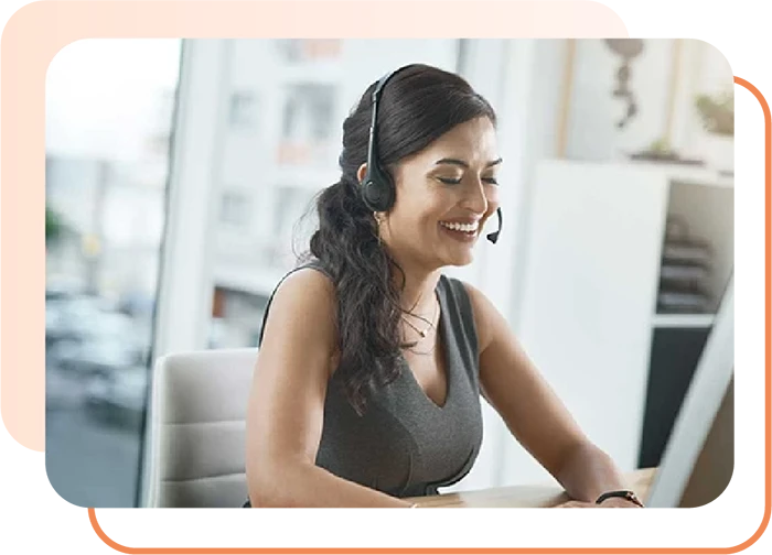Dentist reviewing patient records while remote dental assistant manages scheduling and insurance tasks